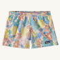 The Patagonia Kids Baggies Shorts in Channeling Spring / Natural are white with a colourful retro spring flowers pattern and have a Patagonia logo tag on the left hem