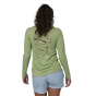 Woman wearing the Patagonia Women's Long Sleeved Capilene Cool Daily Graphic Shirt - Salvia Green X-Dye showing the back of the top