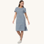 A person wearing the Patagonia Women's Regenerative T-Shirt Dress - Sunset Stripe/Light Plume Grey showing the front of the dress 