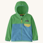 Patagonia little kids green and blue micro d fleece jacket on a beige background