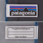 The Patagonia logo and name label sewen into the stitching in the inside of the fleece