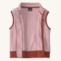 The inside of the Patagonia Little Kids Synchilla Fleece Vest, in pink with a light brown zipper and waste band
