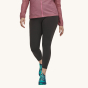Patagonia Women's Maipo 7/8 Sports Leggings - Black. A woman models the leggings facing towards the camera on a plain background.