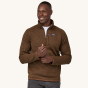 A man models the front of the Patagonia Men's Better Sweater Fleece 1/4 Zip - Moose Brown on a plain background.