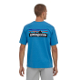Man stood backwards on a white background wearing the Patagonia eco-friendly P-6 logo responsibili-tee in the anacapa blue colour