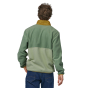 Man wearing the Patagonia Men's Microdini 1/2 Zip Top - Salvia Green showing the back of the top