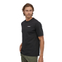 Man stood on a white background wearing the Patagonia organic cotton p6 logo t-shirt in black