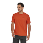 Man stood in the Patagonia eco-friendly p-6 mission logo tshirt in metric orange on a white background