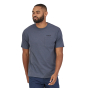 Man stood forwards wearing the Patagonia eco-friendly last ascent pocket tshirt in plume grey on a white background