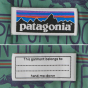 The Patagonia logo and name label sewn into the stitching in the inside of the jacket