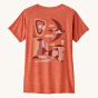 Patagonia Women's Capilene Cool Daily Graphic Shirt - Granite Swift / Pimento Red X-Dye. This photo shows a Patagonia logo of a swift flying over a rock formation on the back of the t-shirt, on a cream background.