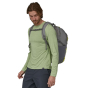 front view of person wearing the Patagonia Refugio Day Pack 30L in a Forge Grey colour way 