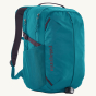 Patagonia Refugio Day Pack Backpack 26L - Belay Blue. Side three-quarter view of the backpack with bike light attached.