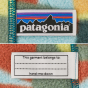 Patagonia Little Kids Synchilla Fleece Hooded Cardigan - Fronterita / Skiff Blue with patterned material, Patagonia label, and Hand Me Down Label