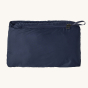 Patagonia Kids Down Sweater - New Navy on a plain background. This is the jacket wrapped inside itself to form a carrying bag.