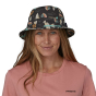 Image of ta person head with long hair wearing the Patagonia Wavefarer Bucket Hat - Fly 50: Ink Black showing the view from the front 