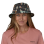 Woman wearing a patternd Patagonia Wavefarer Bucket Hat 