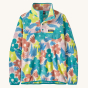 Patagonia Women's Lightweight Synchilla Snap-T Fleece Pullover - Channeling Spring / Natural on a cream background. This fleece has bright, colourful flower print details in pink, green, yellow and blue.