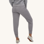 Patagonia Women's Ahnya Pants - Salt Grey on a plain background. A woman models the back view of the pants.
