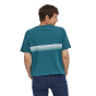 Woman stood backwards wearing the Patagonia eco-friendly abalone blue ridge line t-shirt on a white background