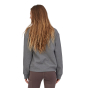 Woman stood backwards wearing the Patagonia organic cotton grey ridge rise stripe sweatshirt