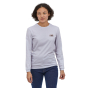 Woman stood in the Patagonia eco-friendly long sleeved 73 skyline responsibili-tee top on a white background