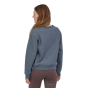 Woman stood backwards wearing the Patagonia eco-friendly adults plume grey uprisal sweatshirt on a white background