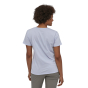 Woman stood backwards wearing the Patagonia cotton p6 logo short sleeve top on a white background