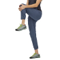 Close up of woman doing stretches on a white background wearing the Patagonia Hampi Rock Pants in Dolomite Blue
