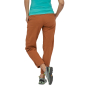 Woman stood backwards on a white background wearing the Patagonia henna brown caliza rock trousers 