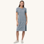 
A person wearing the Patagonia Women's Regenerative T-Shirt Dress - Sunset Stripe/Light Plume Grey showing the front of the dress 
