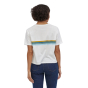 Woman standing backwards wearing the Patagonia organic cotton easy cut white t-shirt with a coloured stripe across the back