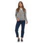 Woman stood on a white background wearing the Patagonia recycled polyester Better Sweater fleece jacket