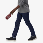 Picture of model holding the hip pack - packed away. Model is standing in front of white background. (Colour of hip pack in picture is red, the hip pack in red is not sold on this website -  picture to show reference of hip pack - packed away).