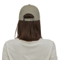 Woman facing backwards on a white background wearing the garden green Patagonia trad cap