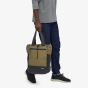 Picture of model carrying the backpack tote style. Picture background is white.