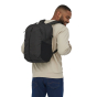 A man wearing a Patagonia Refugio Day Pack 26L - Black, back top view, standing upright on a white background