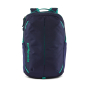 The Patagonia Refugio Day Pack 26L - Classic Navy/Fresh Teal, stood upright on white background