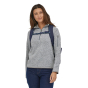 A woman wearing the Patagonia Refugio Day Pack 26L - Classic Navy, stood upright, front top view, on a white background