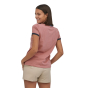 Woman stood backwards wearing the eco-friendly Patagonia light star pink ringer t-shirt on a white background