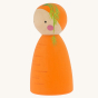 Peepul plastic-free handmade wooden carrot peg doll toy on an off-white background. Side angle.