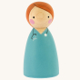 Peepul plastic-free handmade wooden female Doctor peg doll toy on an off-white background.