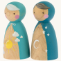 Peepul plastic-free handmade wooden night and day peg doll toy on an off-white background. Side angle.