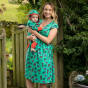 Woman wearing Piccalilly Adult Mountain Bear Women's Wrap Dress with child wearing a matching playsuit