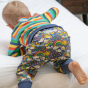 back of baby wearing pull up trousers with cosmic weather print from piccalilly