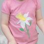 close up of a child wearing pink organic cotton t-shirt with the white daffodil applique from piccalilly