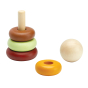 Pieces of the PlanToys plastic-free wooden stacking rings toy laid out on a white background