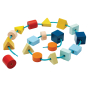 PlanToys kids plastic-free wooden lacing blocks in a spiral shape on a white background