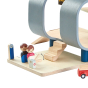 Close up of the moving barrier on the PlanToys wooden central station toy set on a white background