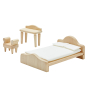 Close up of the PlanToys Victorian dollhouse bedroom furniture toy set on a white background 
